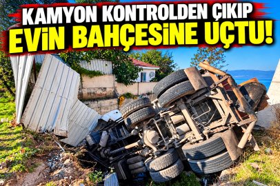 KAMYON EVİN BAHÇESİNE DEVRİLDİ
